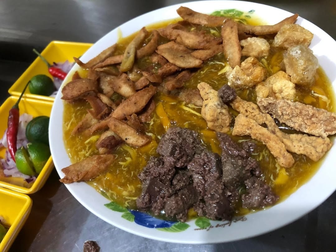 Signature Lomi Bowl - Thick noodles, rich broth, crispy toppings